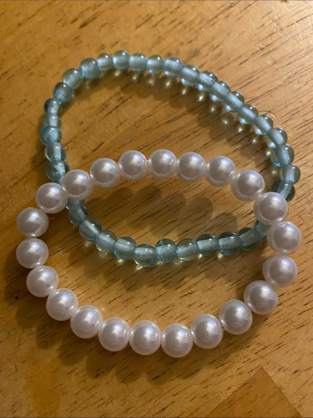 V! White faux pearl and blue tone bracelets pre-owned condition